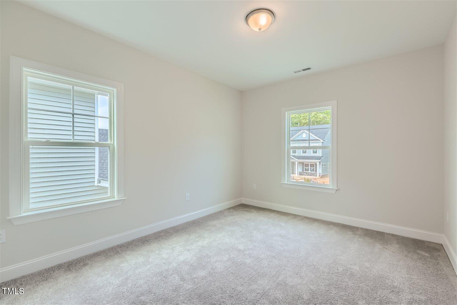 128 Eden View Bend, Unit 672 Raleigh, NC 27610 - Photo 11 of 16 an empty room with a window