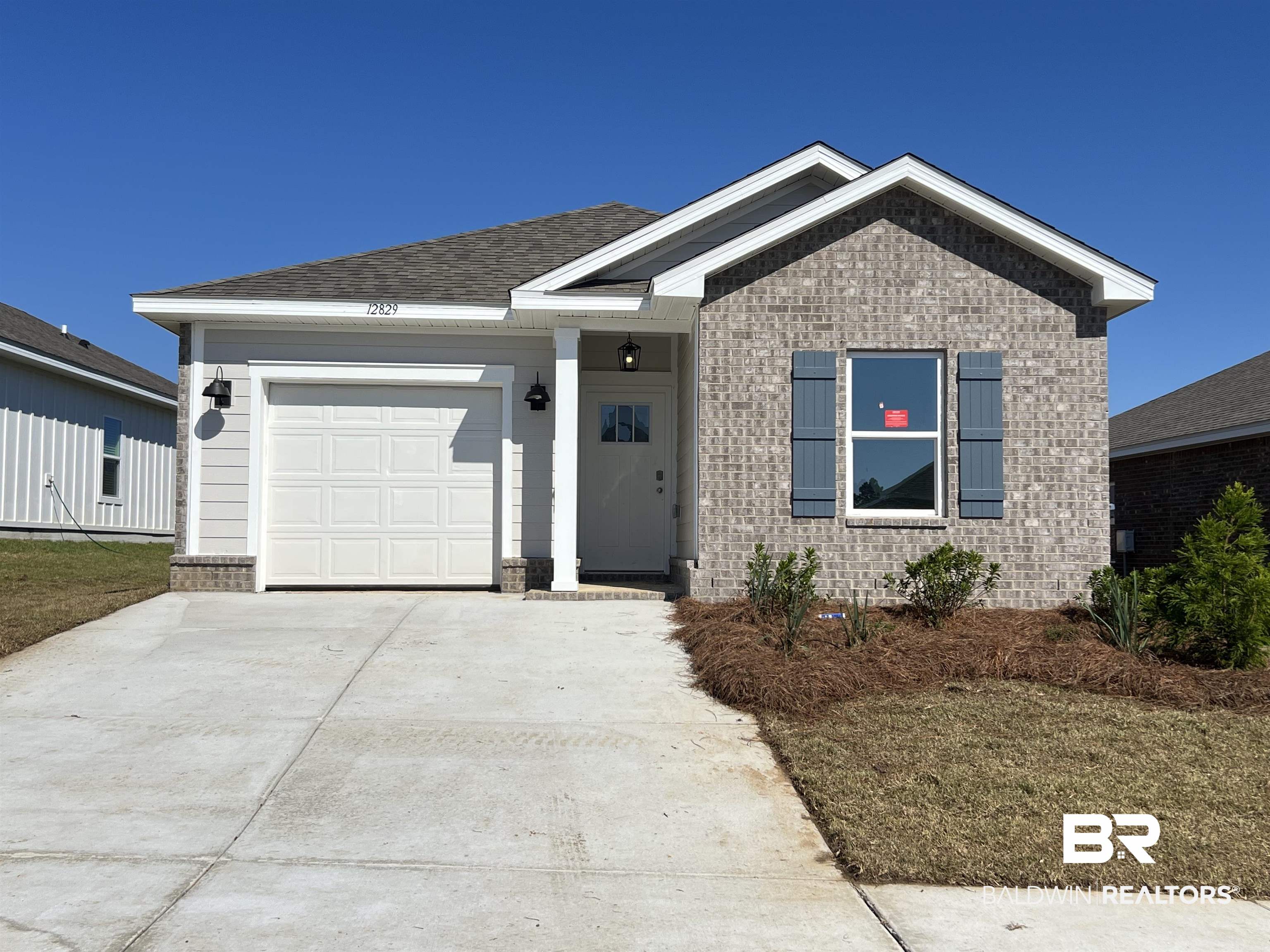 12829 Patriot Way Daphne, AL 36527 - Photo 1 of 38 View of front of home with a garage and a front yard