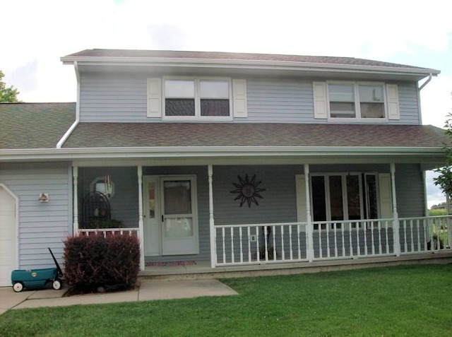 5351 South Mill Pond Road Rochelle, IL 61068 - Photo 1 of 17 a front view of a house with a yard