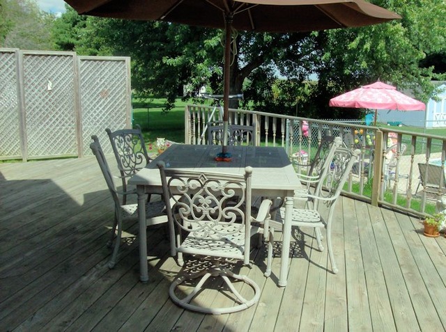 5351 South Mill Pond Road Rochelle, IL 61068 - Photo 15 of 17 a view of a table and chairs on the roof deck