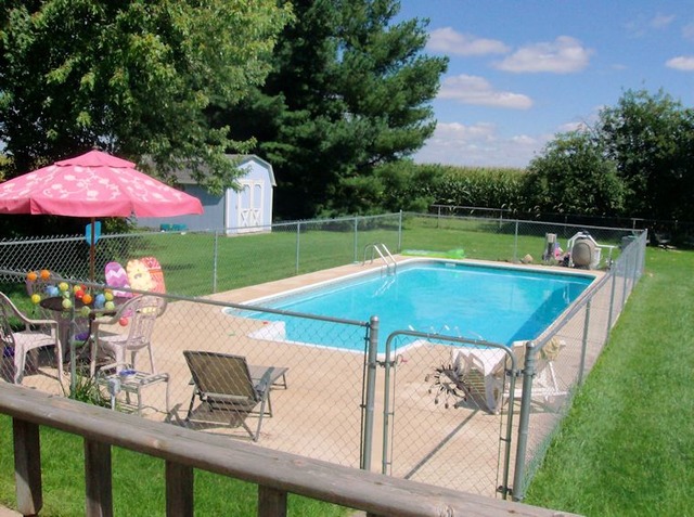 5351 South Mill Pond Road Rochelle, IL 61068 - Photo 16 of 17 a view of a swimming pool with a patio