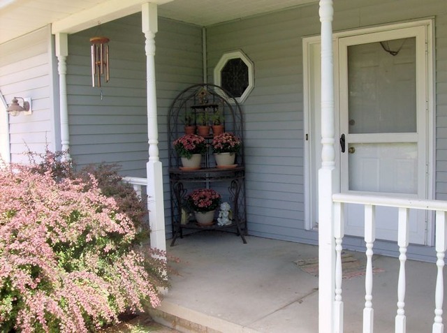 5351 South Mill Pond Road Rochelle, IL 61068 - Photo 2 of 17 a couple of people sitting in front of a door
