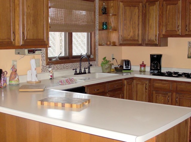 5351 South Mill Pond Road Rochelle, IL 61068 - Photo 3 of 17 a kitchen with kitchen island granite countertop a sink a counter top space and cabinets
