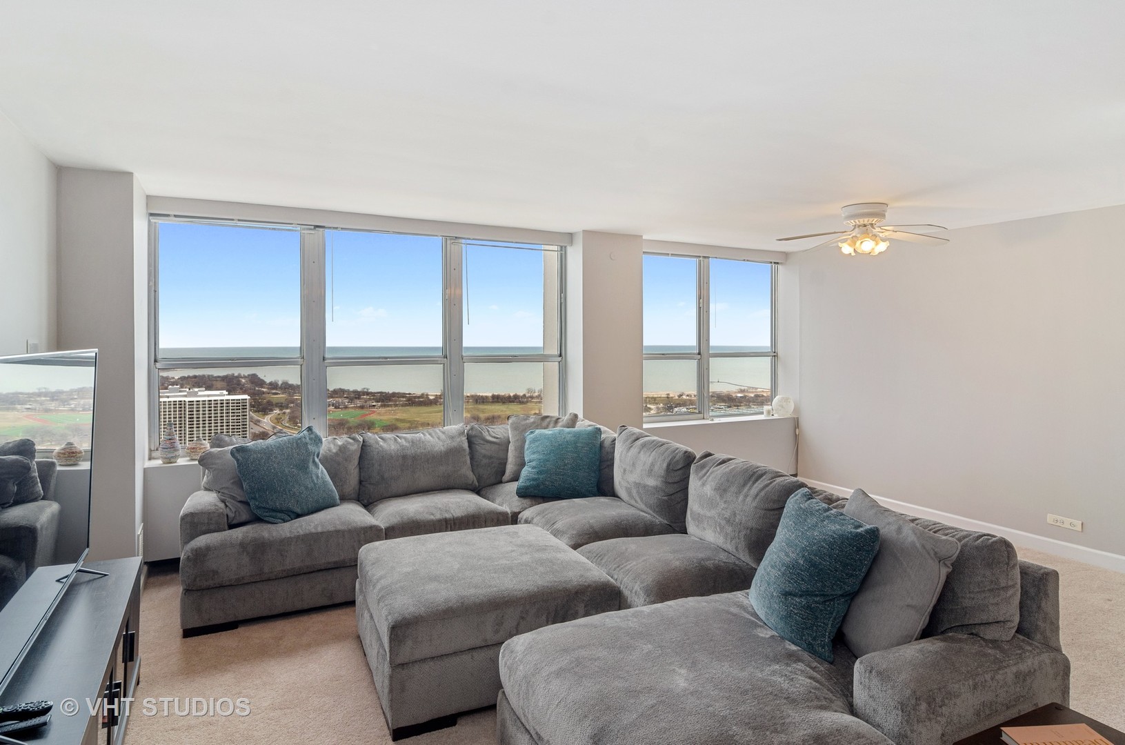 655 Irving Park Road, Unit 4606 Chicago, IL 60613 - Photo 2 of 15 a living room with furniture and a window