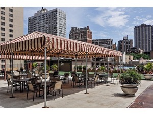 655 Irving Park Road, Unit 4606 Chicago, IL 60613 - Photo 13 of 15 a view of a cafe with sitting area