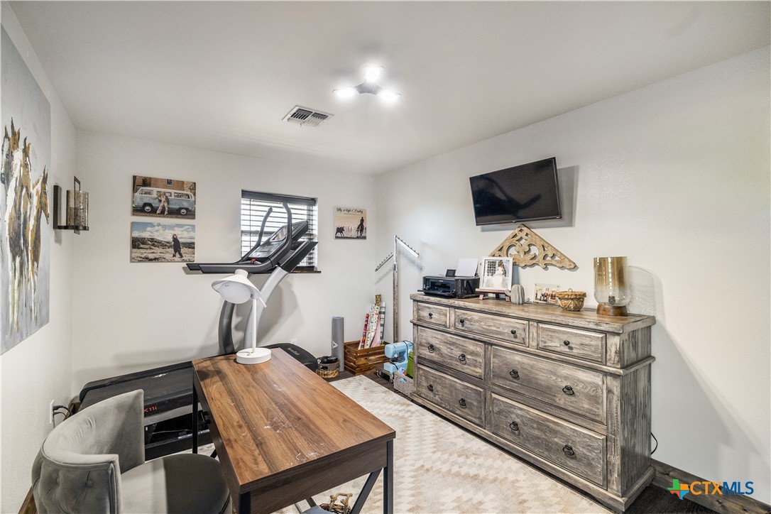 2796 Benbow Road Inez, TX 77968 - Photo 21 of 35 a room with furniture and a flat screen tv
