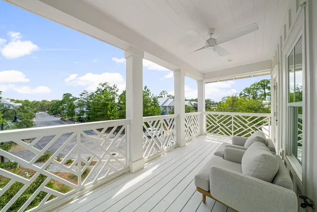 a front view of a house with a garden and plants