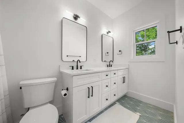 a couple of cars parked in front of a building