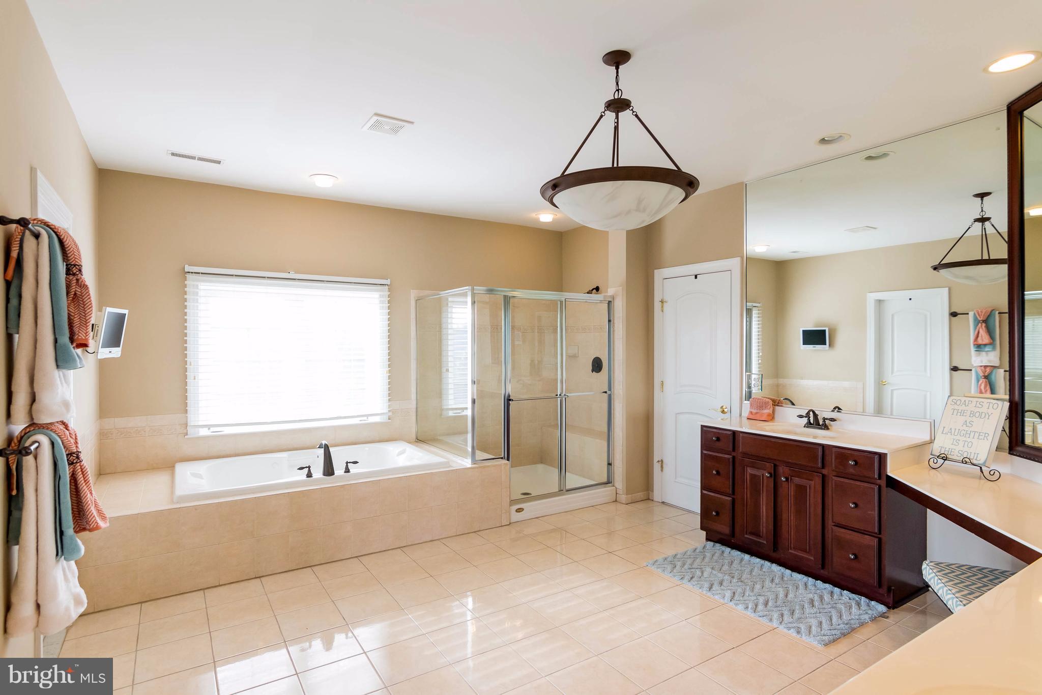 2404 Long Ridge Road Reisterstown, MD 21136 - Photo 17 of 30 a spacious bathroom with a double vanity sink mirror and bathtub