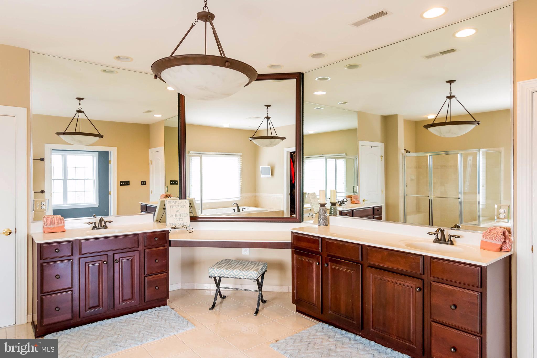 2404 Long Ridge Road Reisterstown, MD 21136 - Photo 18 of 30 a large bathroom with a sink mirror double vanity and a bathtub
