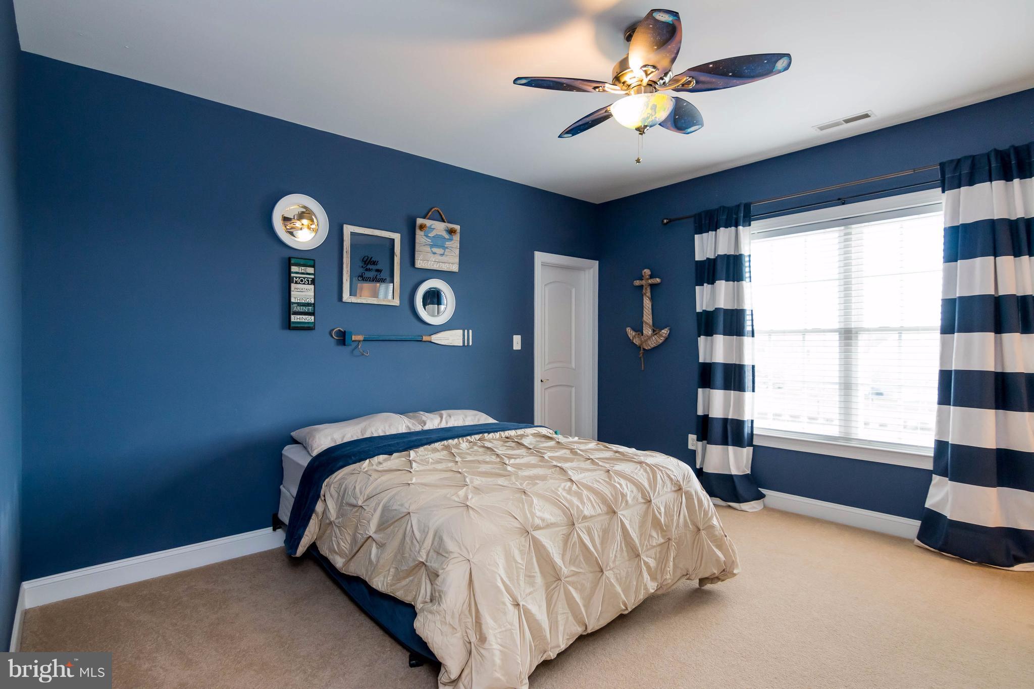 2404 Long Ridge Road Reisterstown, MD 21136 - Photo 20 of 30 a bedroom with a bed and a chandelier