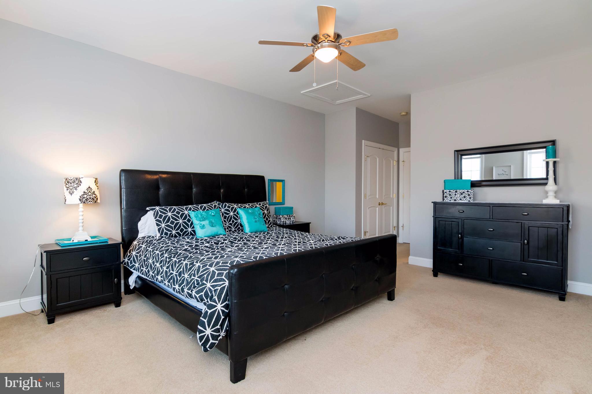 2404 Long Ridge Road Reisterstown, MD 21136 - Photo 21 of 30 a bedroom with a bed and a dresser