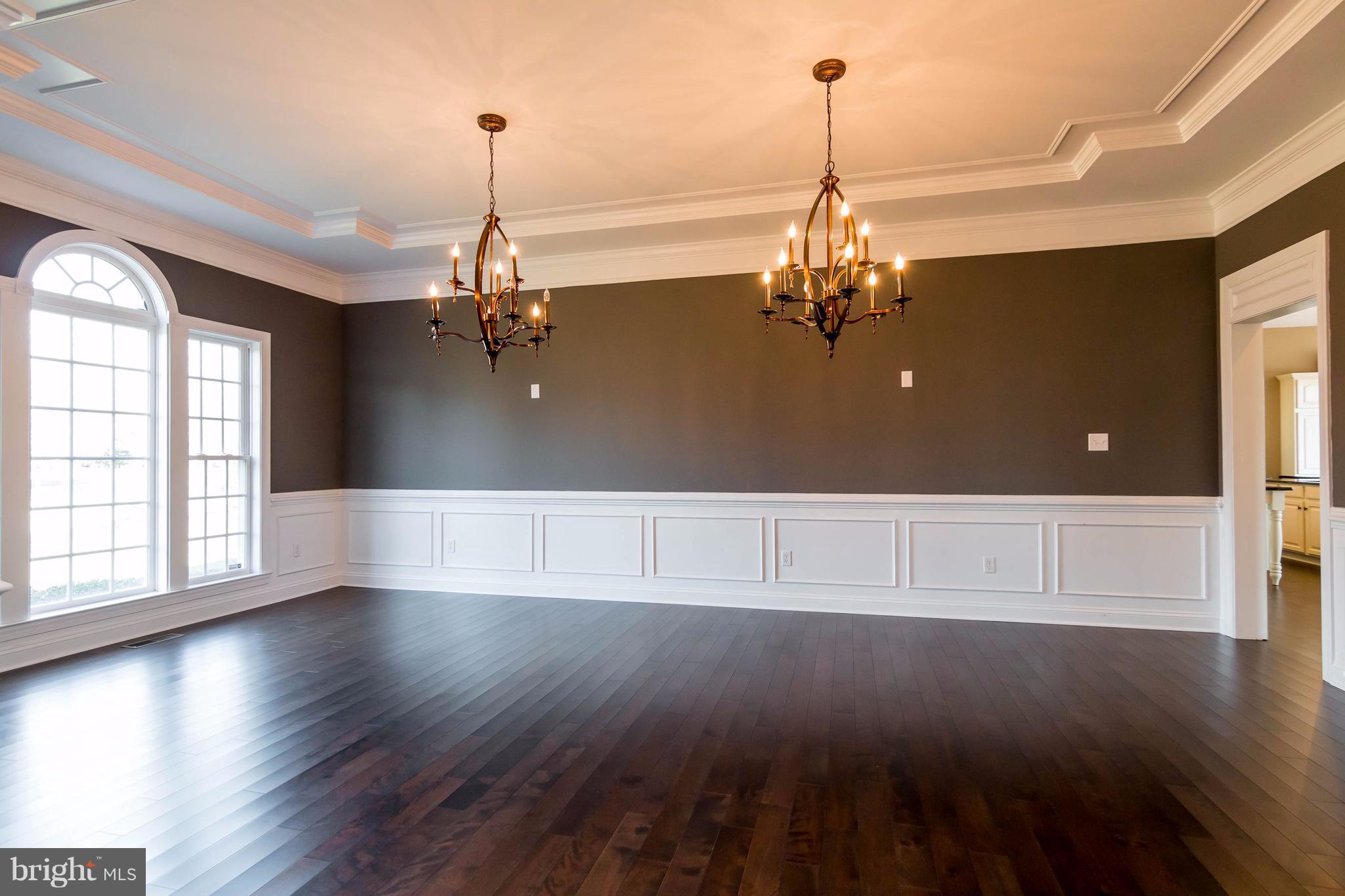 2404 Long Ridge Road Reisterstown, MD 21136 - Photo 4 of 30 an empty room with wooden floor chandelier and windows