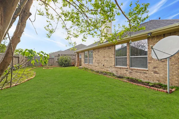 a backyard of a house with lots of green space