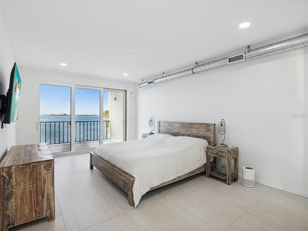 50 Coe Road, Unit 126 Belleair, FL 33756 - Photo 11 of 39 a bedroom with a bed and a window