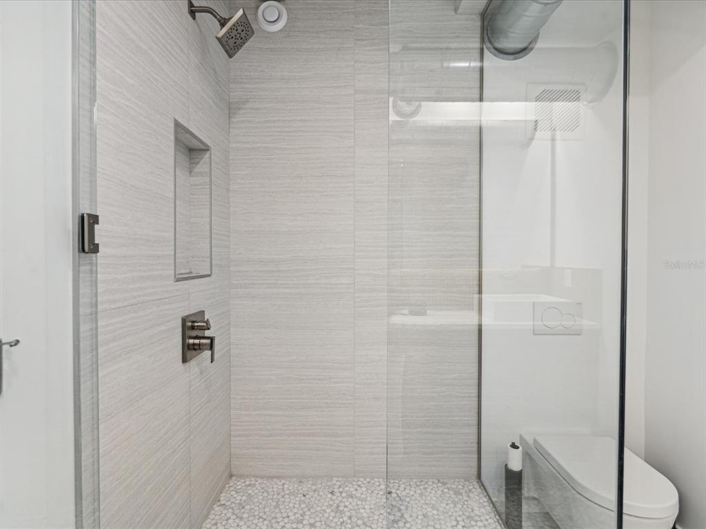 50 Coe Road, Unit 126 Belleair, FL 33756 - Photo 17 of 39 a bathroom with a shower