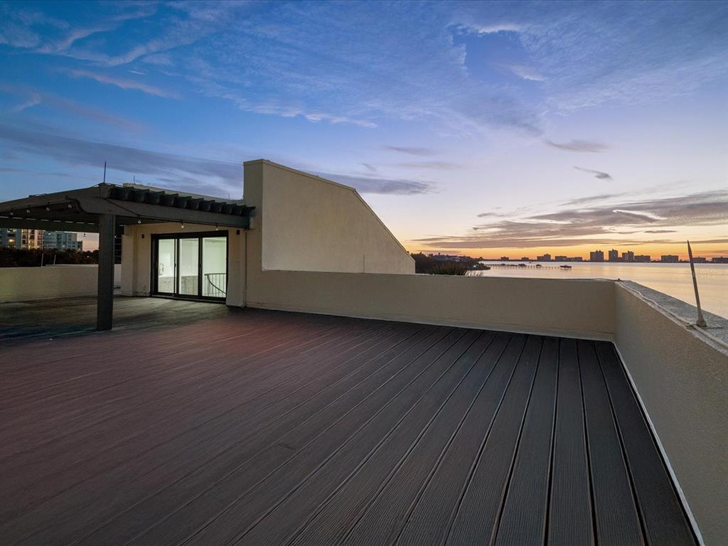 50 Coe Road, Unit 126 Belleair, FL 33756 - Photo 33 of 39 a view of a hardwood floor and a ceiling fan in a room