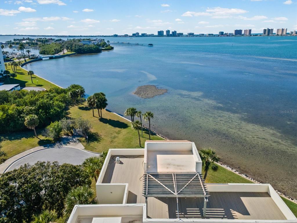 50 Coe Road, Unit 126 Belleair, FL 33756 - Photo 34 of 39 an aerial view of a house with pool lake view and mountain view