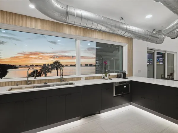 a kitchen with a sink and cabinets