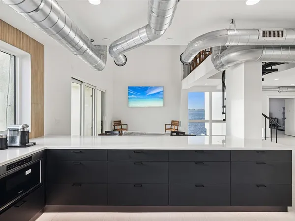 a bathroom with a sink vanity and mirror