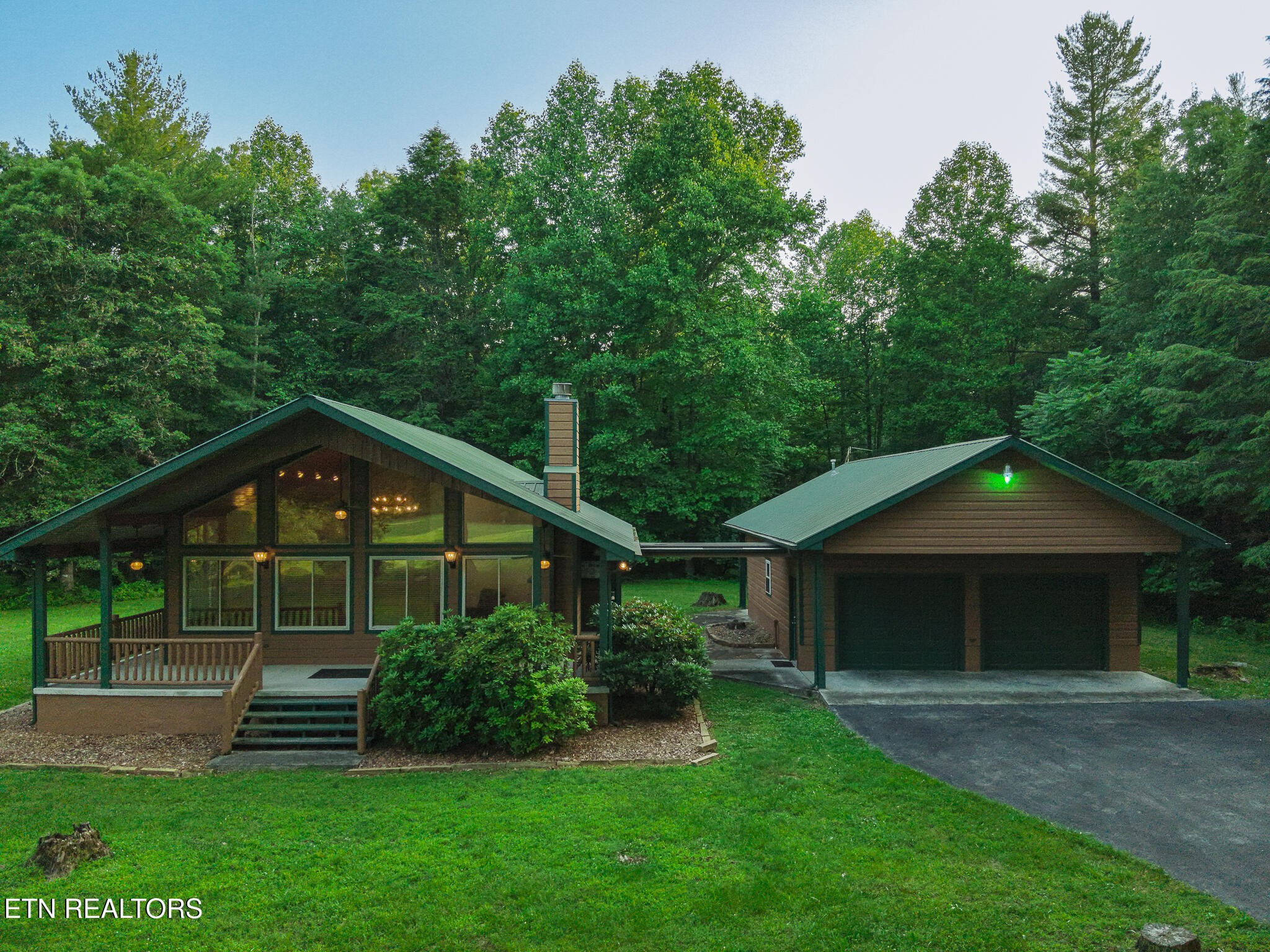 2457 Mayland Road Crossville, TN 38571 - Photo 14 of 33 a front view of a house with a yard