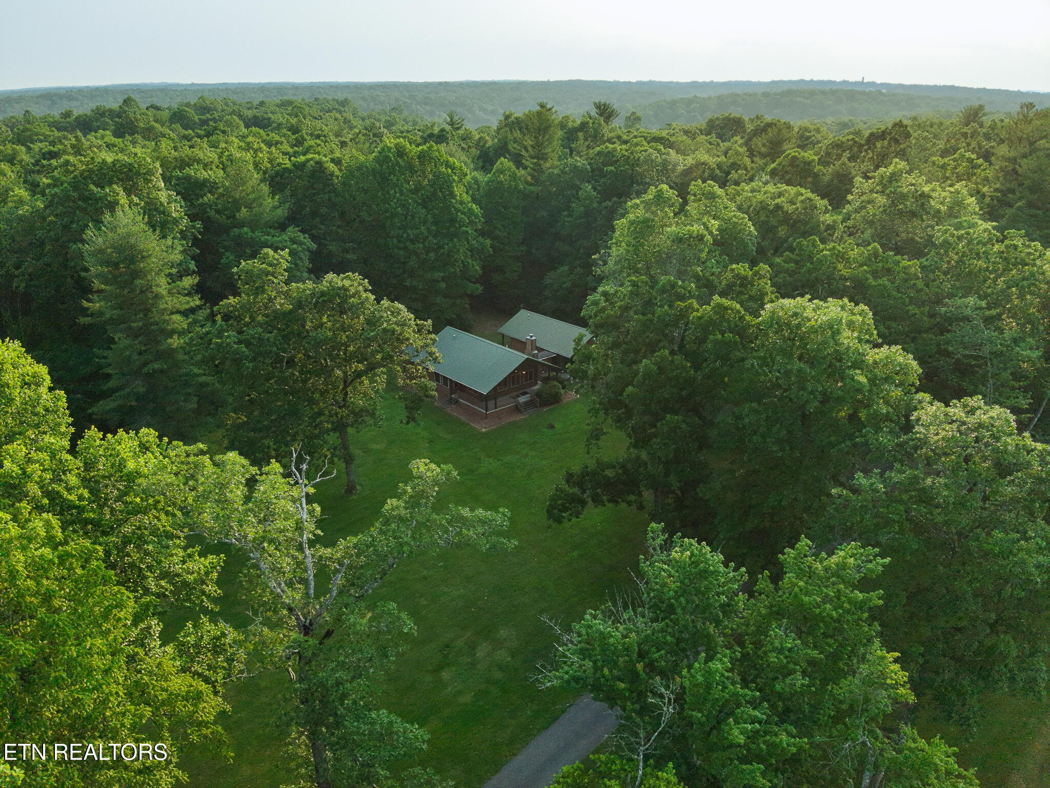 2457 Mayland Road Crossville, TN 38571 - Photo 15 of 33 a view of a forest with a street
