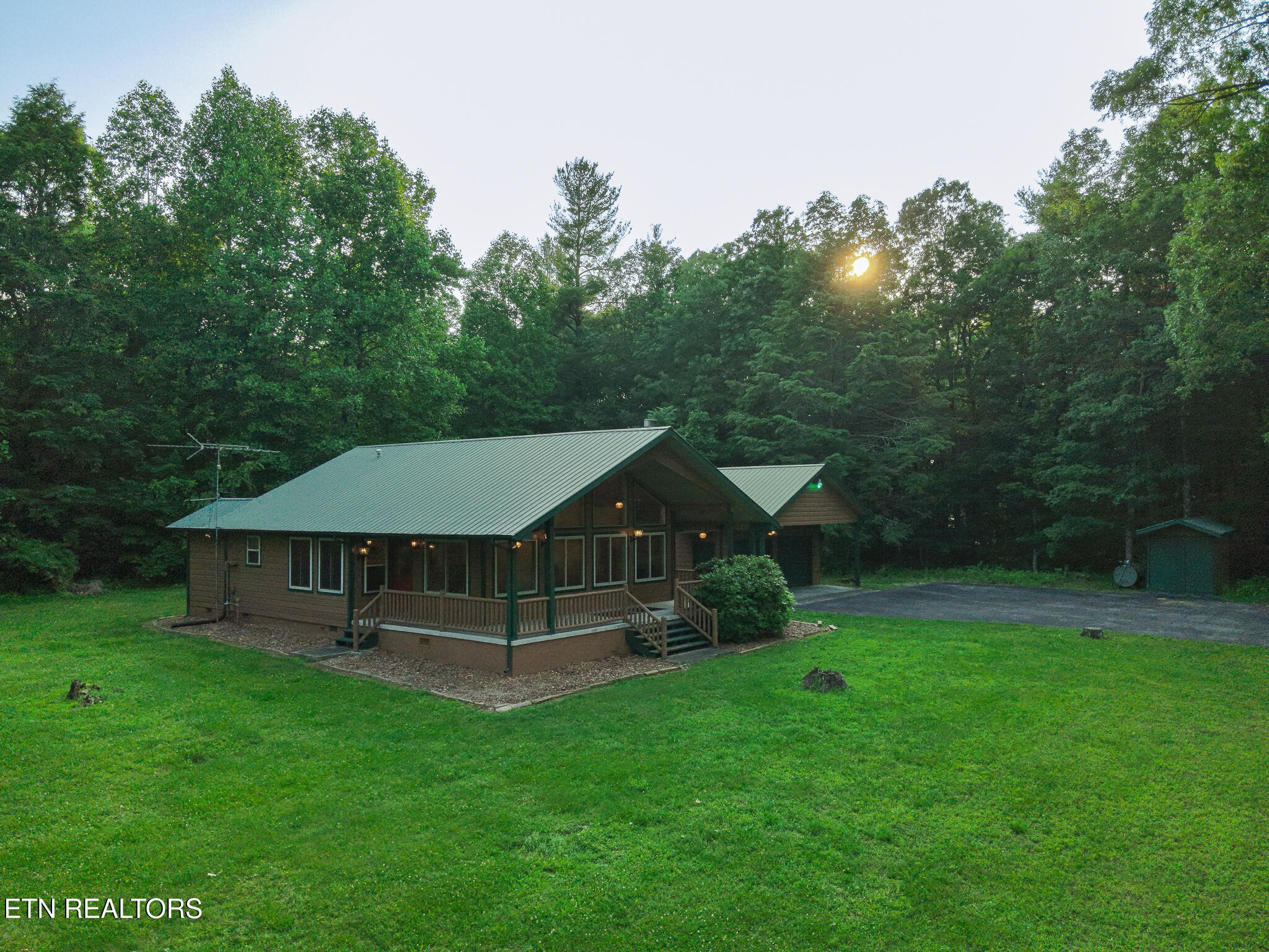 2457 Mayland Road Crossville, TN 38571 - Photo 15 of 37 a view of a house with backyard and garden