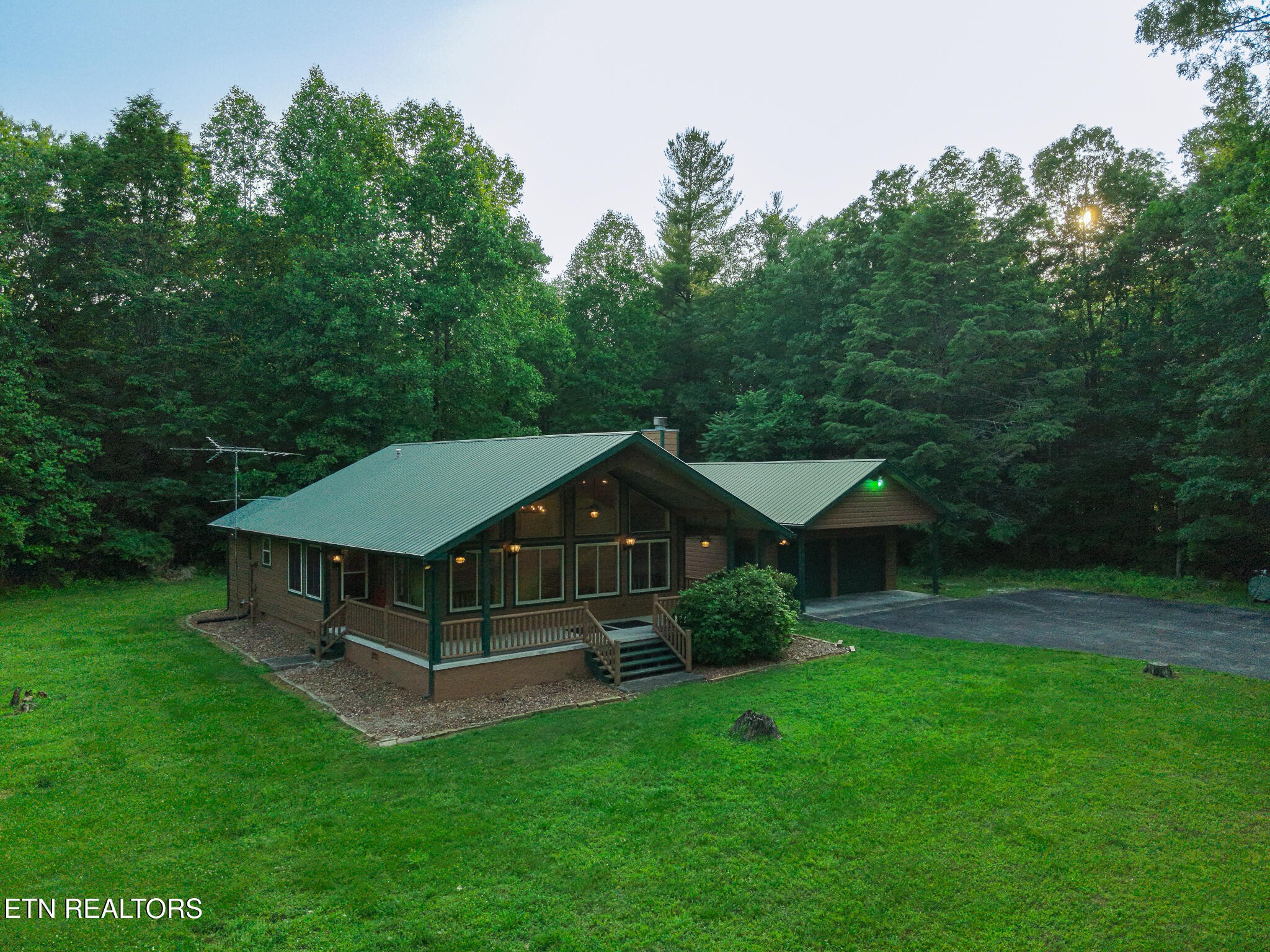2457 Mayland Road Crossville, TN 38571 - Photo 16 of 37 a aerial view of a house with a yard table and chairs