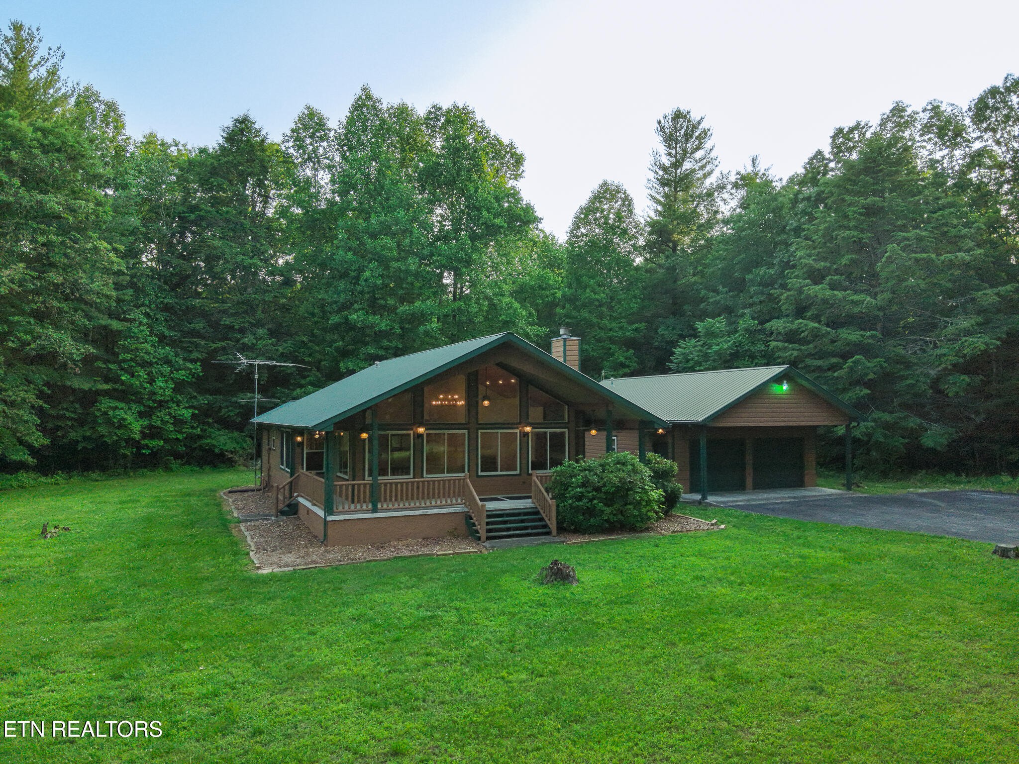 2457 Mayland Road Crossville, TN 38571 - Photo 17 of 37 a view of a house with a yard