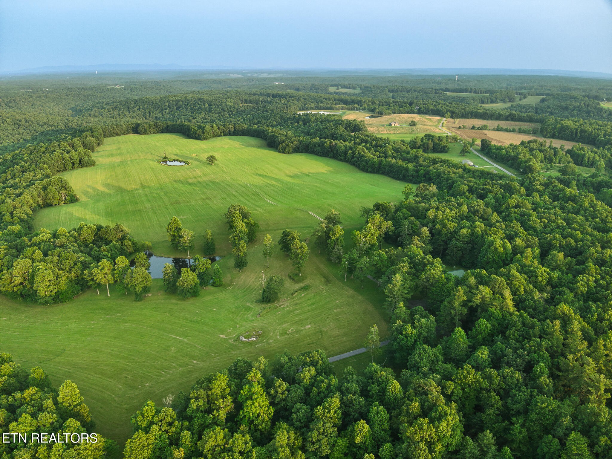 2457 Mayland Road Crossville, TN 38571 - Photo 19 of 33 a view of a green field with an ocean