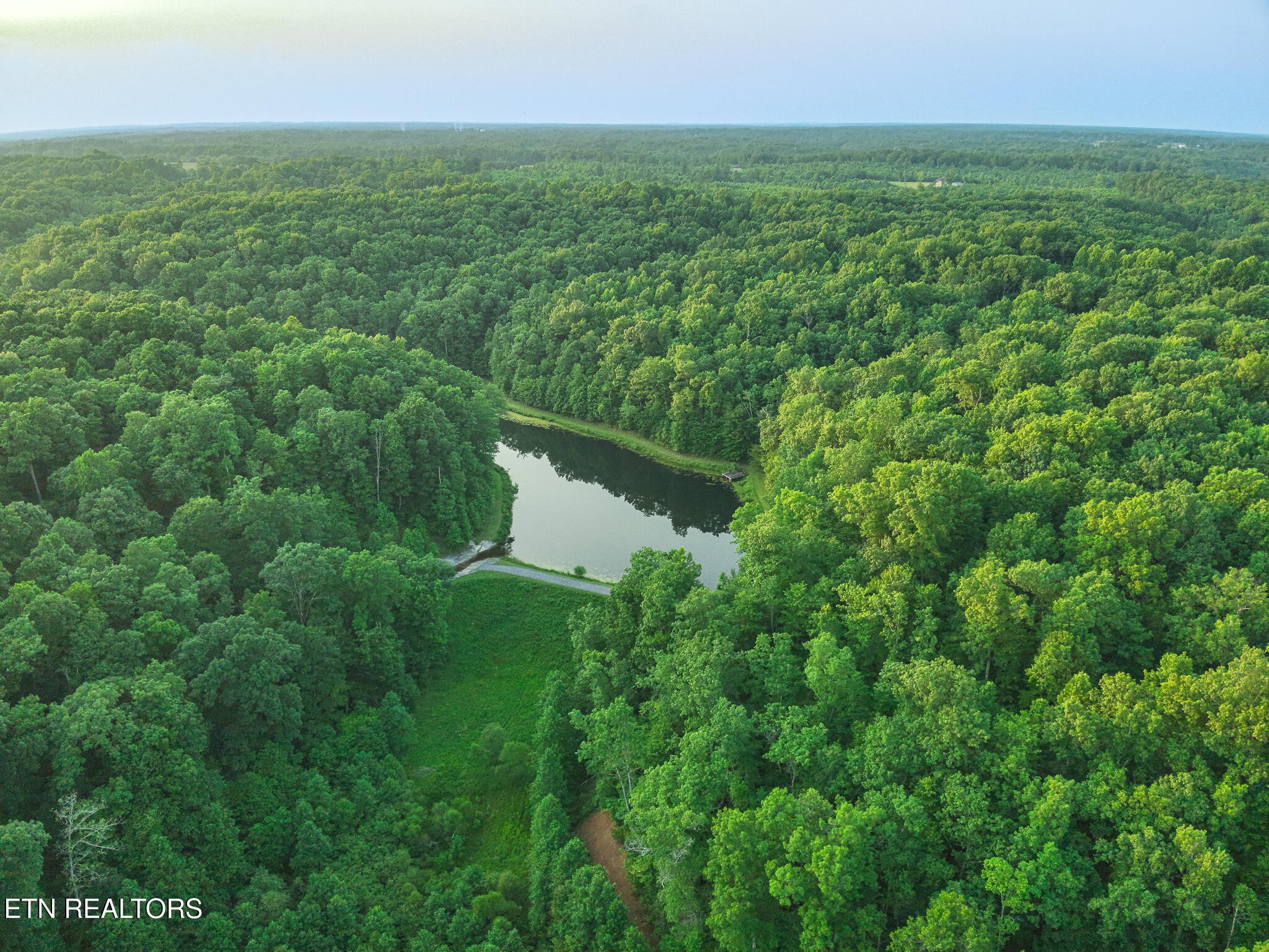 2457 Mayland Road Crossville, TN 38571 - Photo 28 of 33 a view of a field of grass and trees