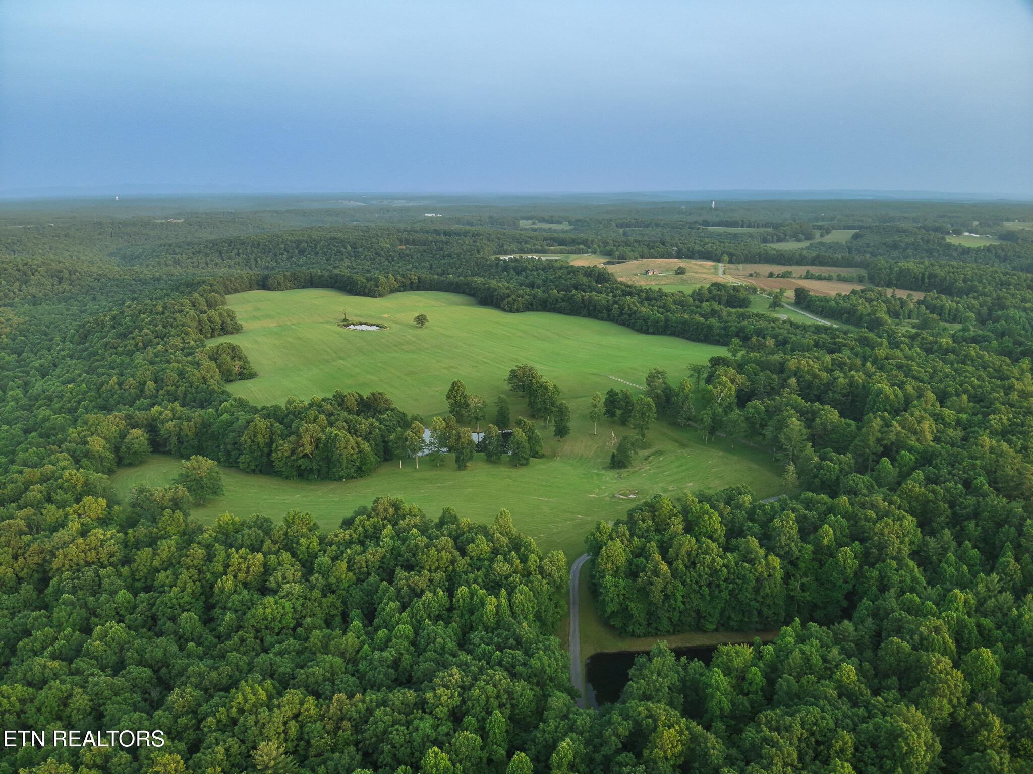 2457 Mayland Road Crossville, TN 38571 - Photo 33 of 37 a view of a green field with lots of green space
