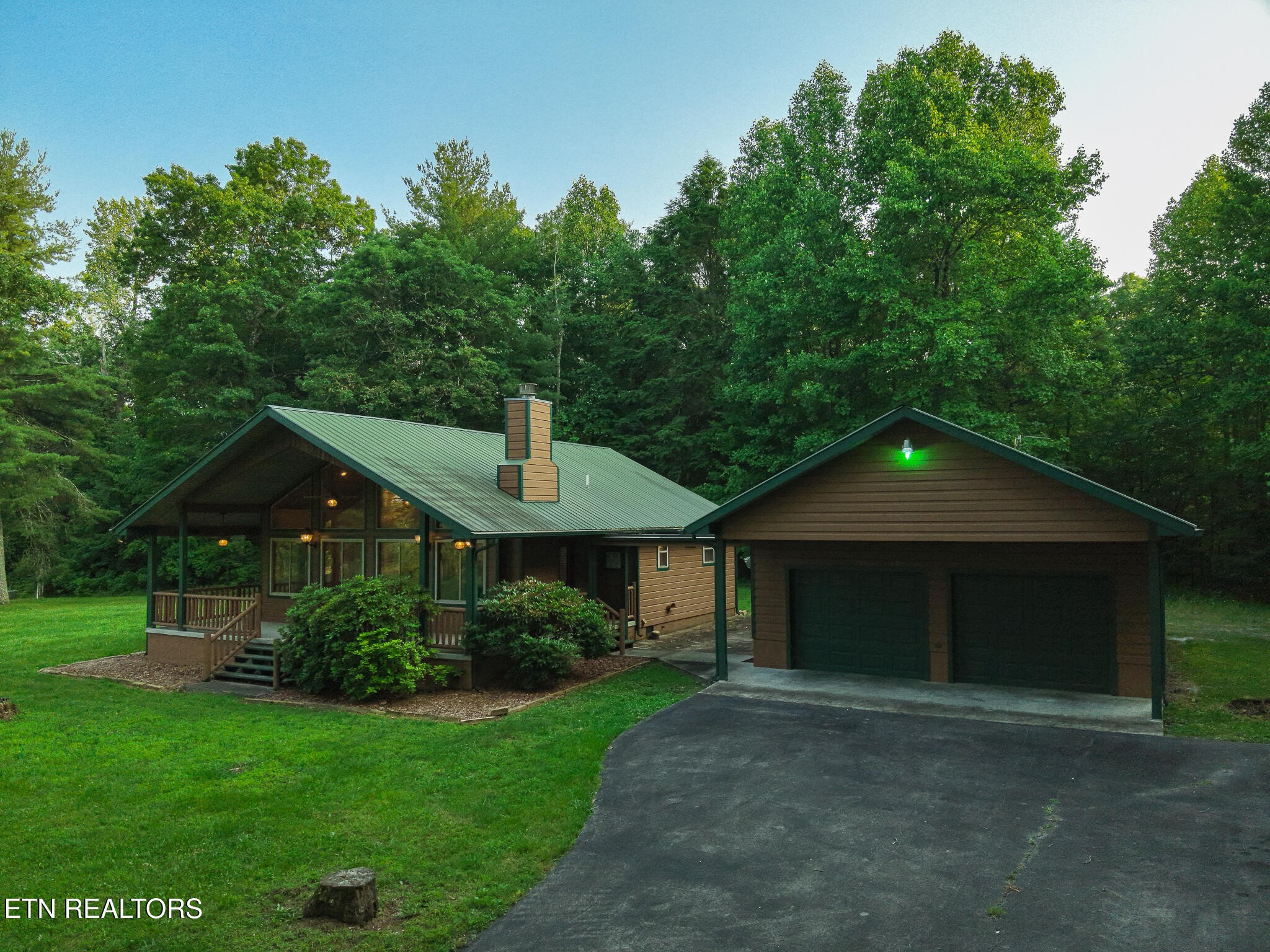 2457 Mayland Road Crossville, TN 38571 - Photo 6 of 37 a front view of a house with a yard and green space