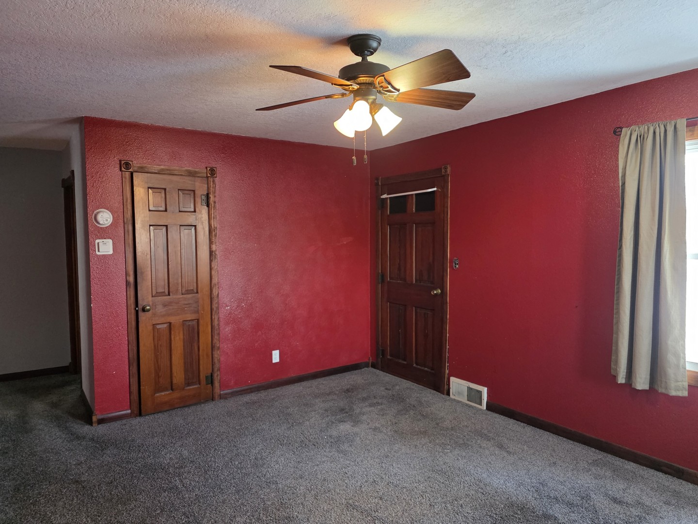 2909 West Le Fevre Road Sterling, IL 61081 - Photo 3 of 11 a view of an empty room with a chandelier fan