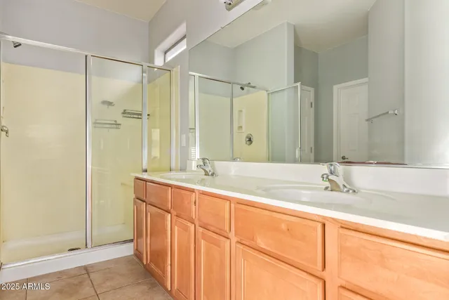 a bathroom with a granite countertop sink mirror and double
