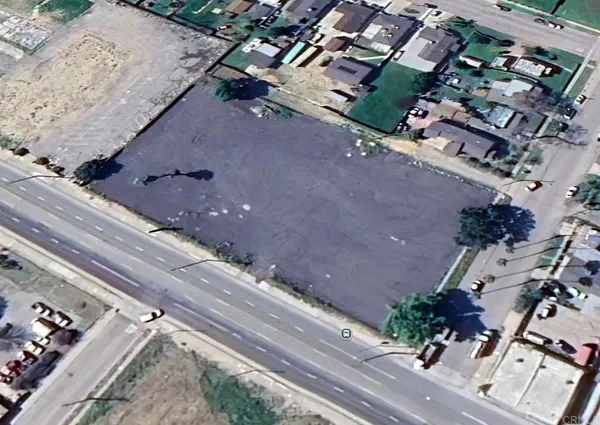 an aerial view of multiple houses with yard