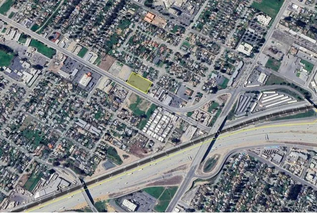 a view of a street with houses on side of road