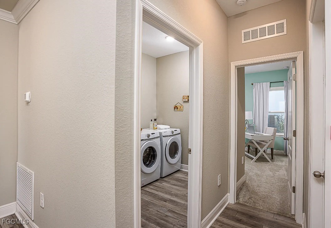 3508 14th Street Southwest Lehigh Acres, FL 33976 - Photo 18 of 23 a view of a bedroom with washer and dryer