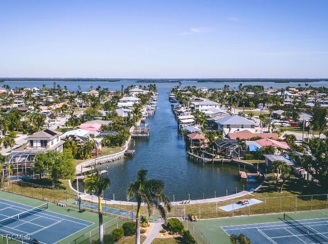3508 14th Street Southwest Lehigh Acres, FL 33976 - Photo 20 of 23 an aerial view of residential houses with outdoor space and lake view in back