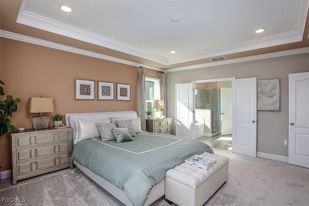 3508 14th Street Southwest Lehigh Acres, FL 33976 - Photo 9 of 23 a bedroom with a large bed and a window