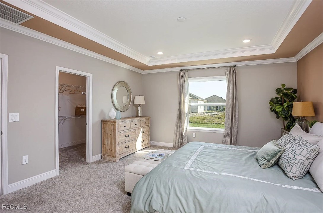 3508 14th Street Southwest Lehigh Acres, FL 33976 - Photo 10 of 23 a bedroom with a bed and a chandelier