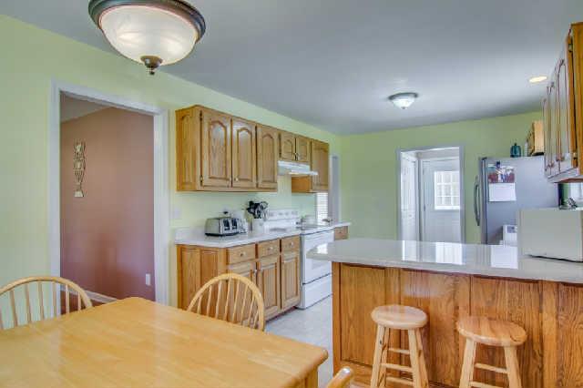 4655 Dugger Road Culleoka, TN 38451 - Photo 8 of 20 Kitchen also has breakfast bar and you exit the home through a mud room.