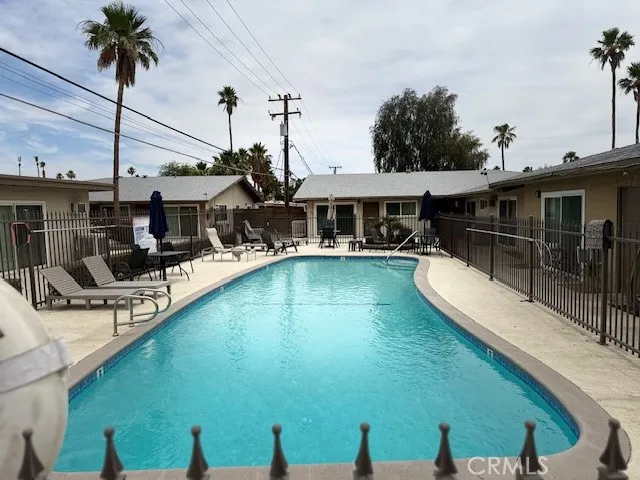 a view of a swimming pool with a patio
