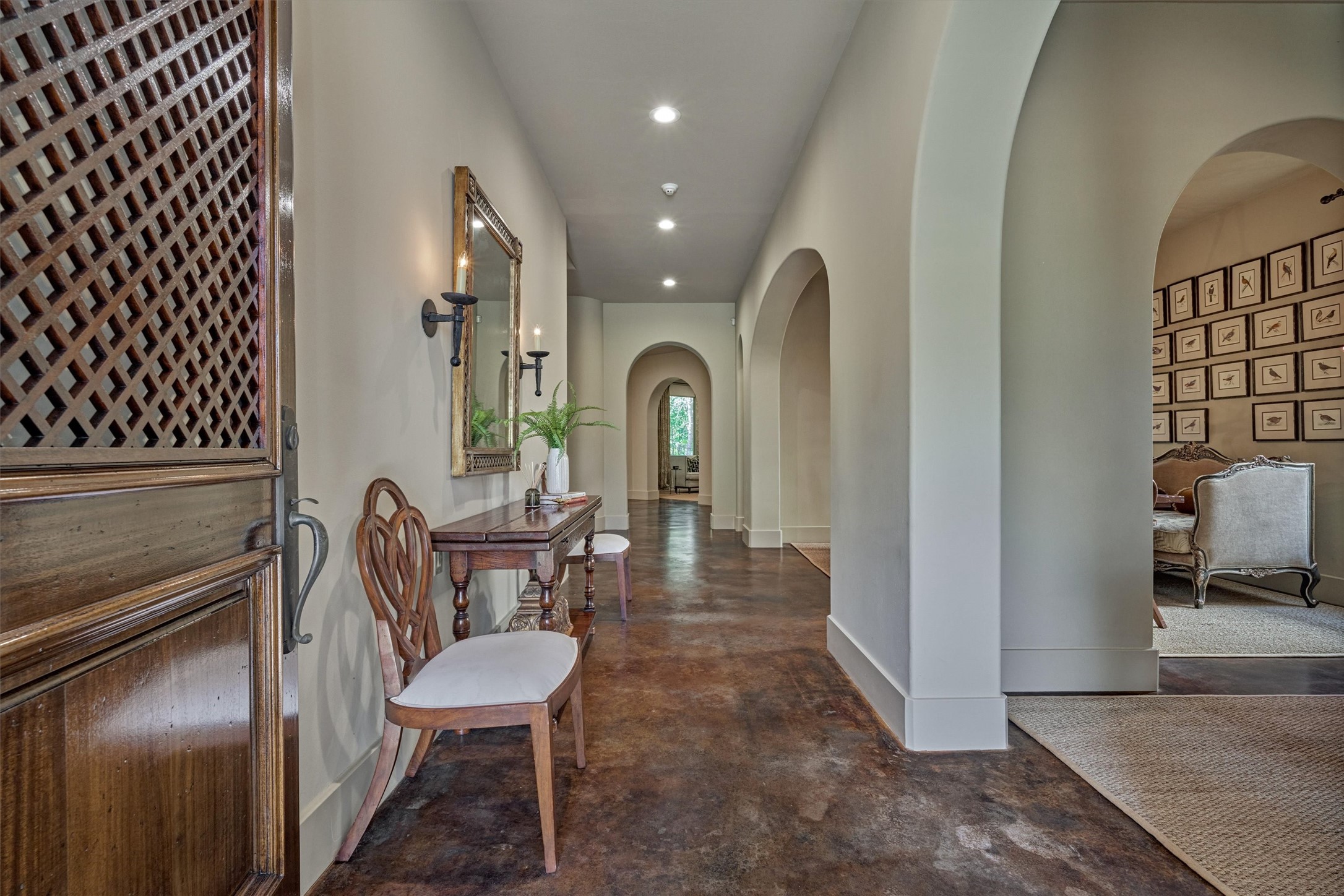 7 Dorset Square The Woodlands, TX 77381 - Photo 6 of 50 Elegant entry with stained concrete floors and trimless doorframes.