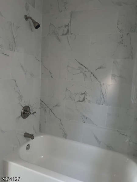 19 White Street Paterson, NJ 07522 - Photo 4 of 9 a bathroom with a bathtub