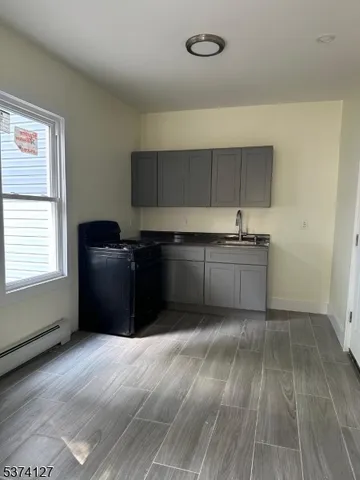 a kitchen with wooden cabinets and a sink