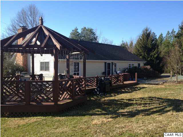 1453 Hanback Road Gordonsville, VA 22942 - Photo 1 of 12 a front view of a house with garden