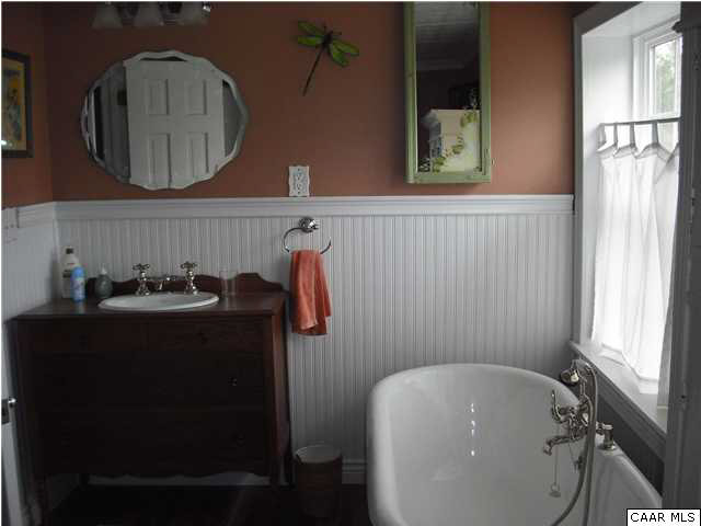 1453 Hanback Road Gordonsville, VA 22942 - Photo 11 of 12 a bathroom with a tub sink and mirror