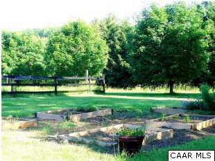 1453 Hanback Road Gordonsville, VA 22942 - Photo 5 of 12 a view of a garden with a bench