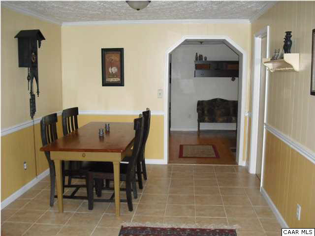 1453 Hanback Road Gordonsville, VA 22942 - Photo 8 of 12 a dining room with furniture and a fireplace